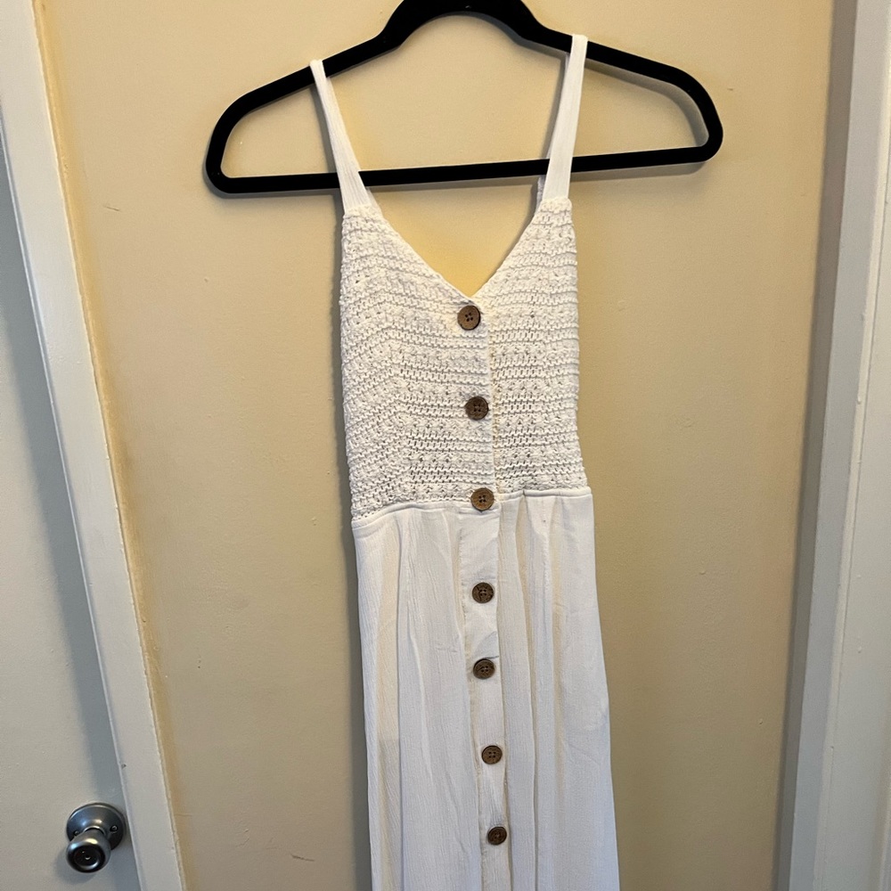 White dress with buttons and open back with a tie